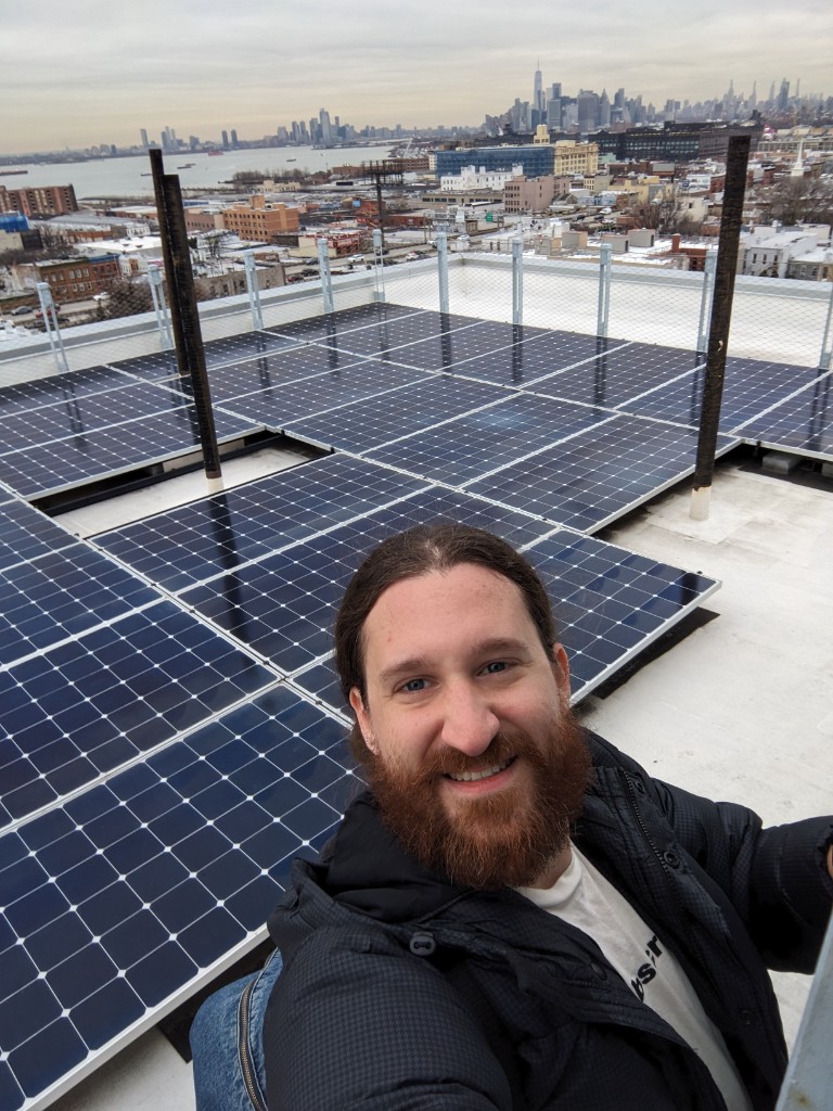 James Mayo on a Brooklyn rooftop with the NYC skyline
